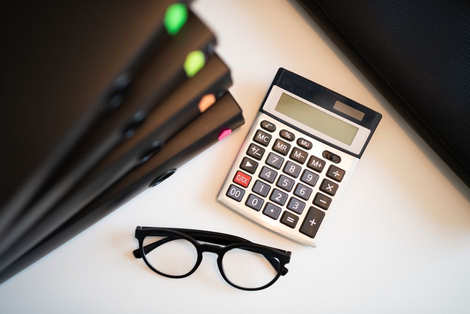 Bookkeeping desk with calculator and records